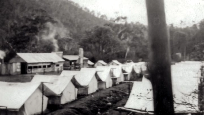 Canvas tents and wooden hut Snowy Mountains temporary camp
