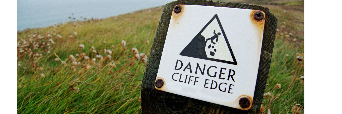 sign warning of cliff edge