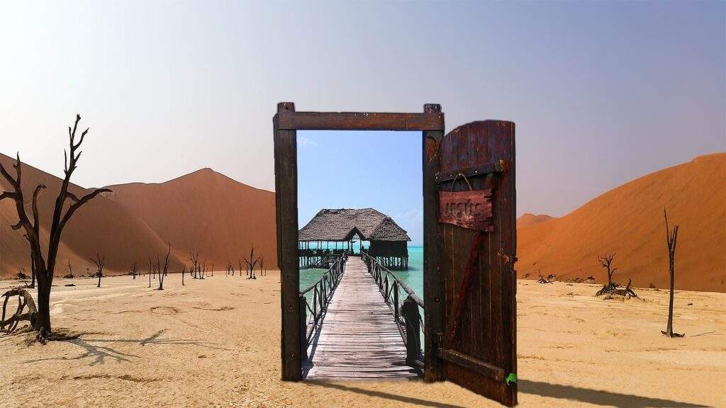Doorway leading to the sea, in a desert
