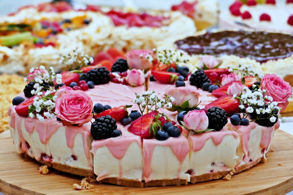 Cake with pink and white icing and flowers