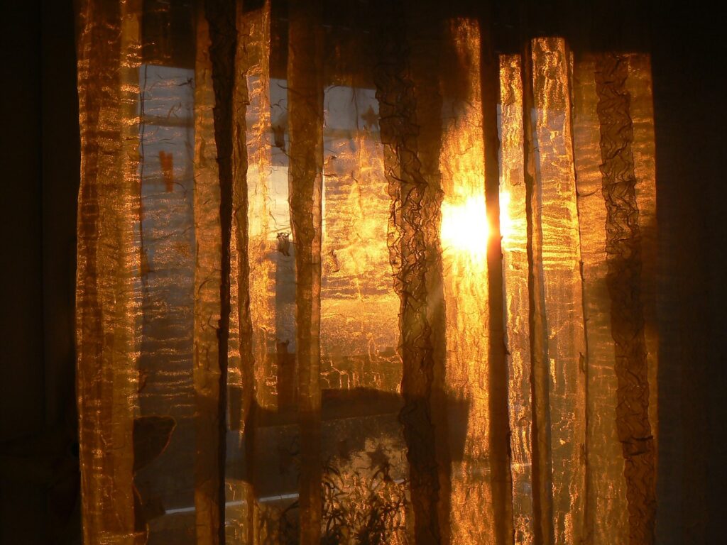 Sunrise glow through curtains
