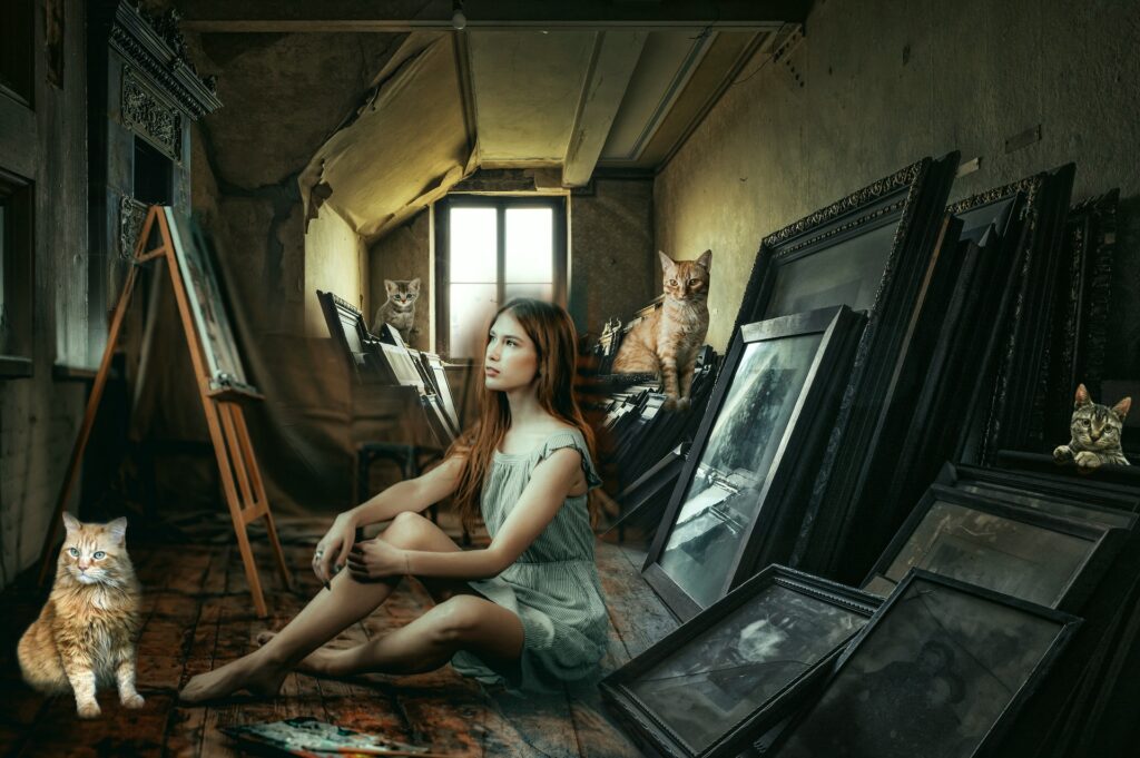 artist in attic with cats