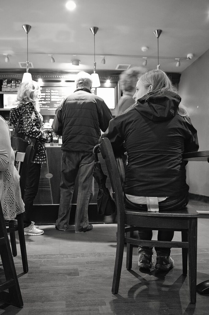 A chair in a coffee shop and a queue
