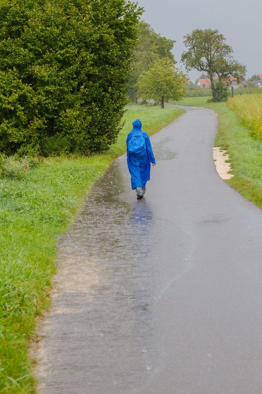 Woman in blue raincoat