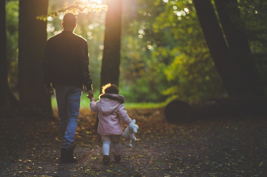 Father and daughter in woods