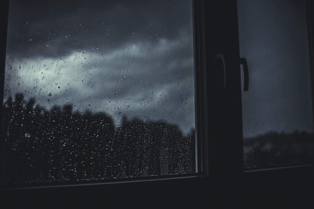 Stormy night seen through a window