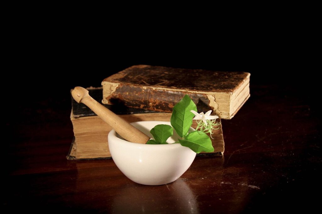 pestle and mortar and old books