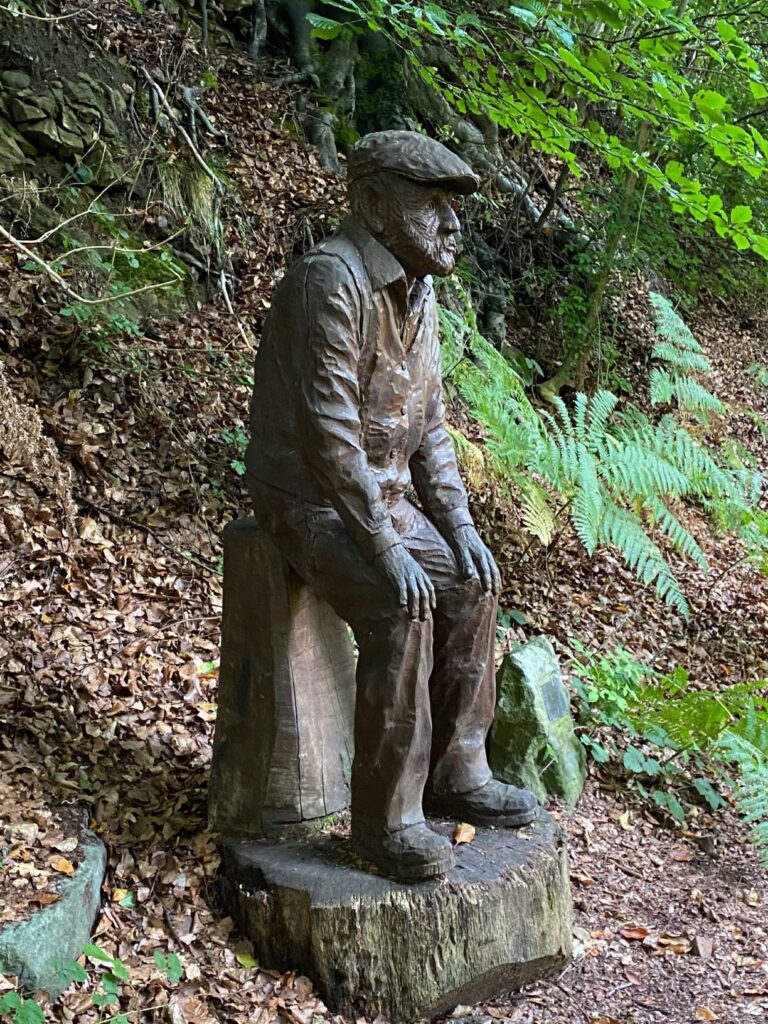Statue of a miner on a Forest path