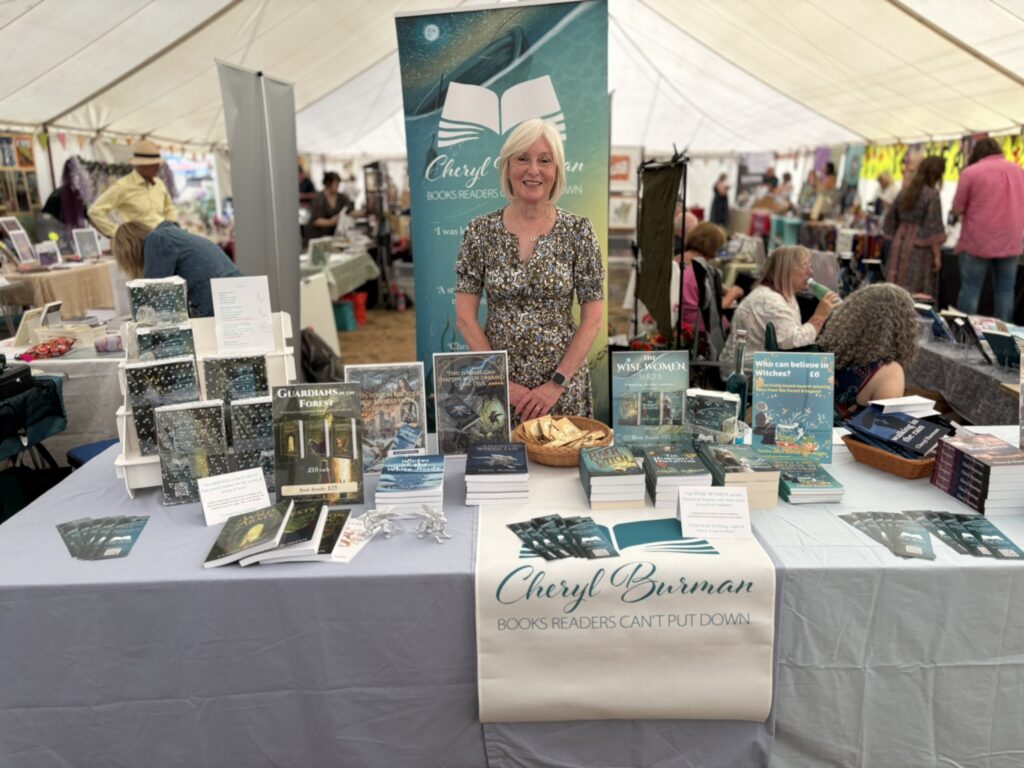 Cheryl at the book fair at her table